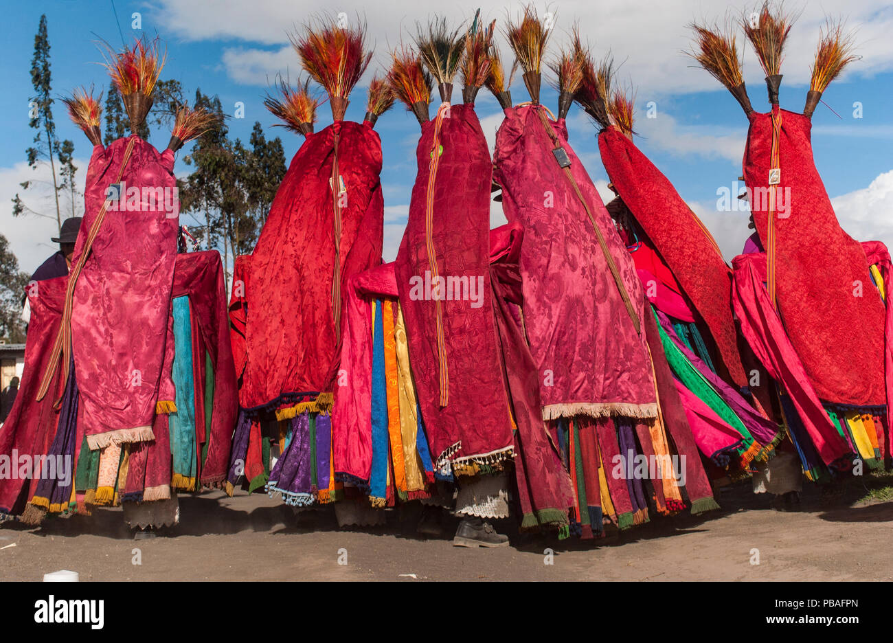 Indigenous Salasaca Indians in colourful garments, celebrating the Inti Raymi festival - or Festival of the Sun, Salasaca, Andes, Ecuador, June 2004. Stock Photo