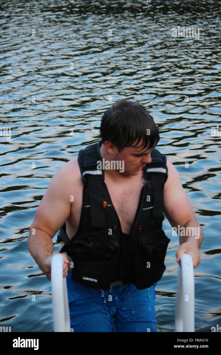 people in life jackets swimming in open sea Stock Photo Alamy