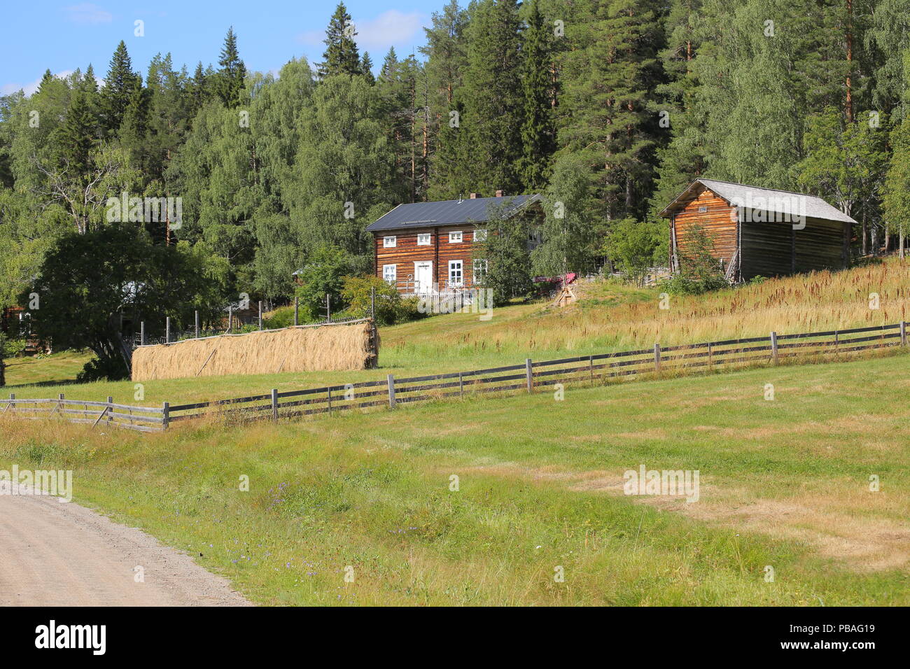 Farm buildings an meadow in cultural reserve area Gallejaur in Norrbotten, Sweden. Stock Photo