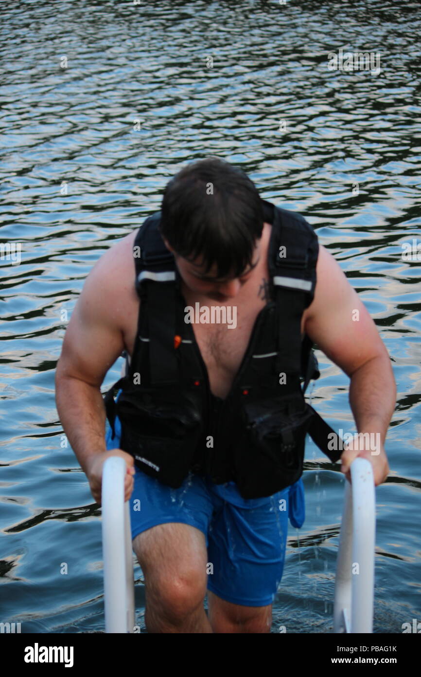 people in life jackets swimming in open sea Stock Photo Alamy
