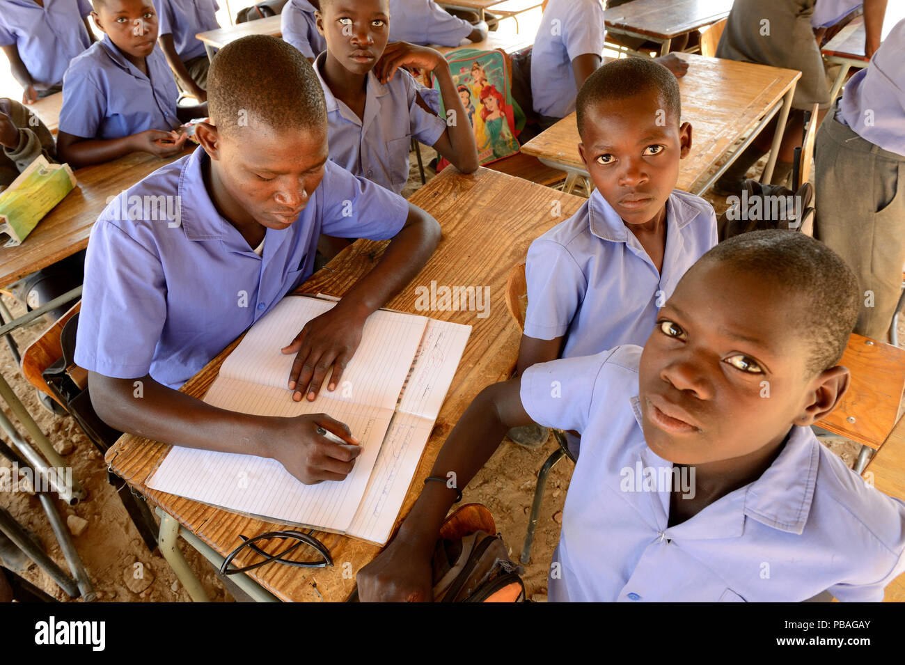 Students of different ages studying in the same class, Etanga School, Kaokoland, Namibia. October 2015 Stock Photo