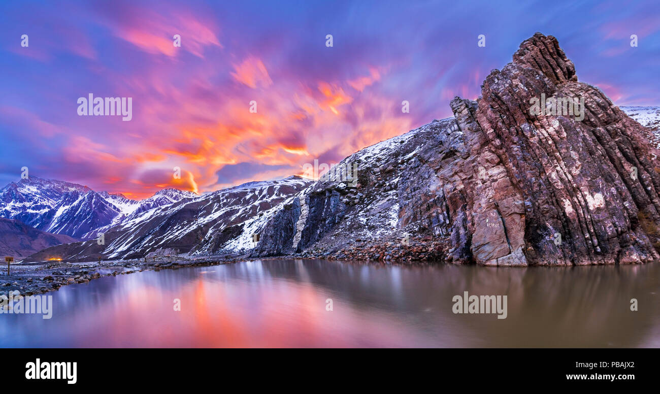 Thermal waters at Termas del Plomo inside Central Andes mountains. Just an amazing view of reflections and colors from the dawn and and an alpine view Stock Photo