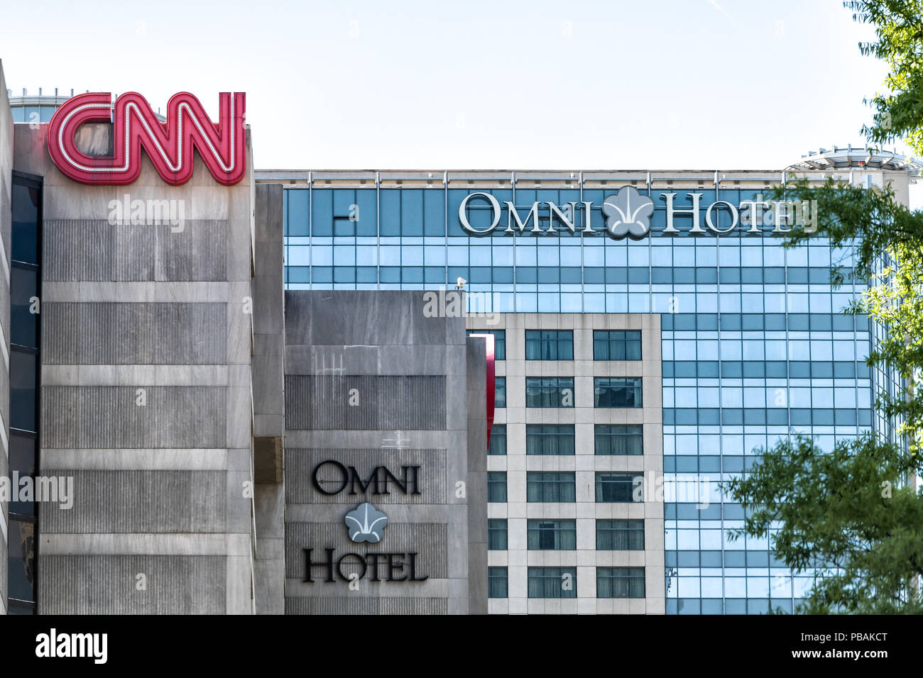 Atlanta, USA - April 20, 2018: CNN Center world headquarters and Omni Hotel buildings in downtown of city with signs Stock Photo