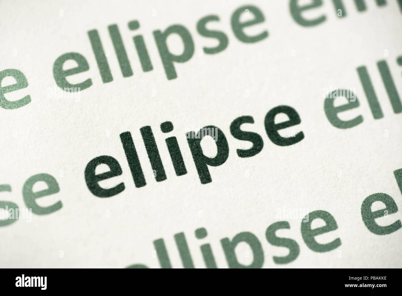 word ellipse printed on white paper macro Stock Photo
