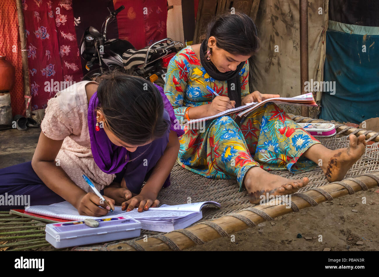 Indian school girls reading book hi-res stock photography and images ...