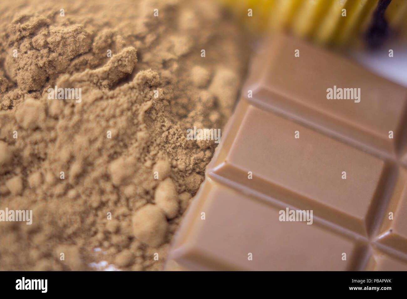 Chocolate bar pieces and cocoa powder on white background. Brown ...