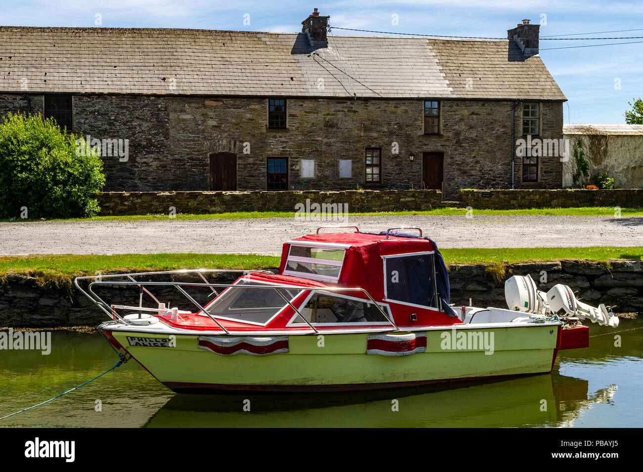 Small motor boat moored in Ballydehob Harbour, Ballydehob, West Cork, Ireland. Stock Photo