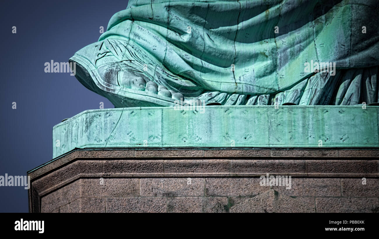 The size 879 foot of the Statue of Liberty rising off its pedestal