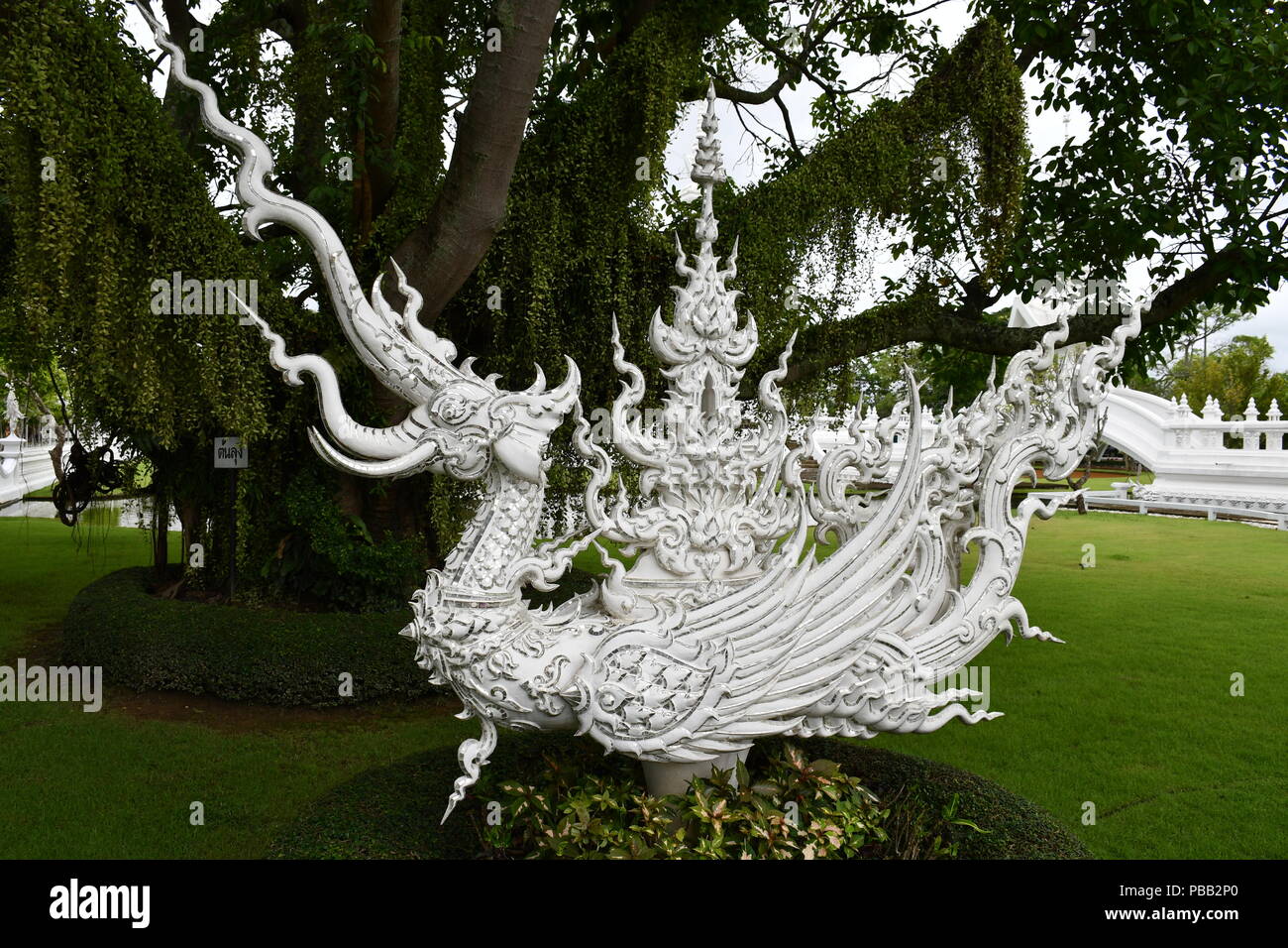 Image collection from The White Temple in Chiang Rai, Thailand that demonstrate the modern art approach of it's creator, Chalermchai Kositpipat. Stock Photo
