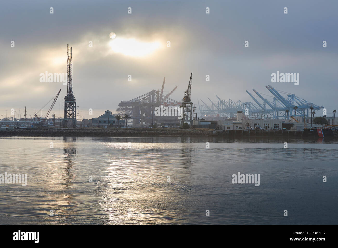 Sun Rising Over The Los Angeles Container Terminal And Terminal Island, California, USA. Stock Photo