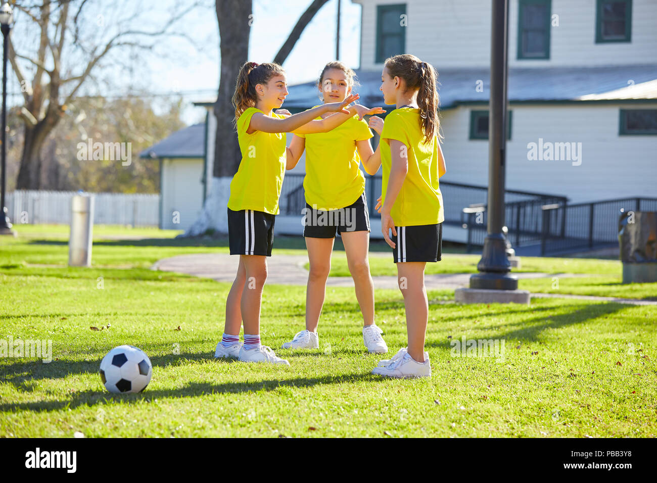 Teen girls group exercise workout at park Stock Photo