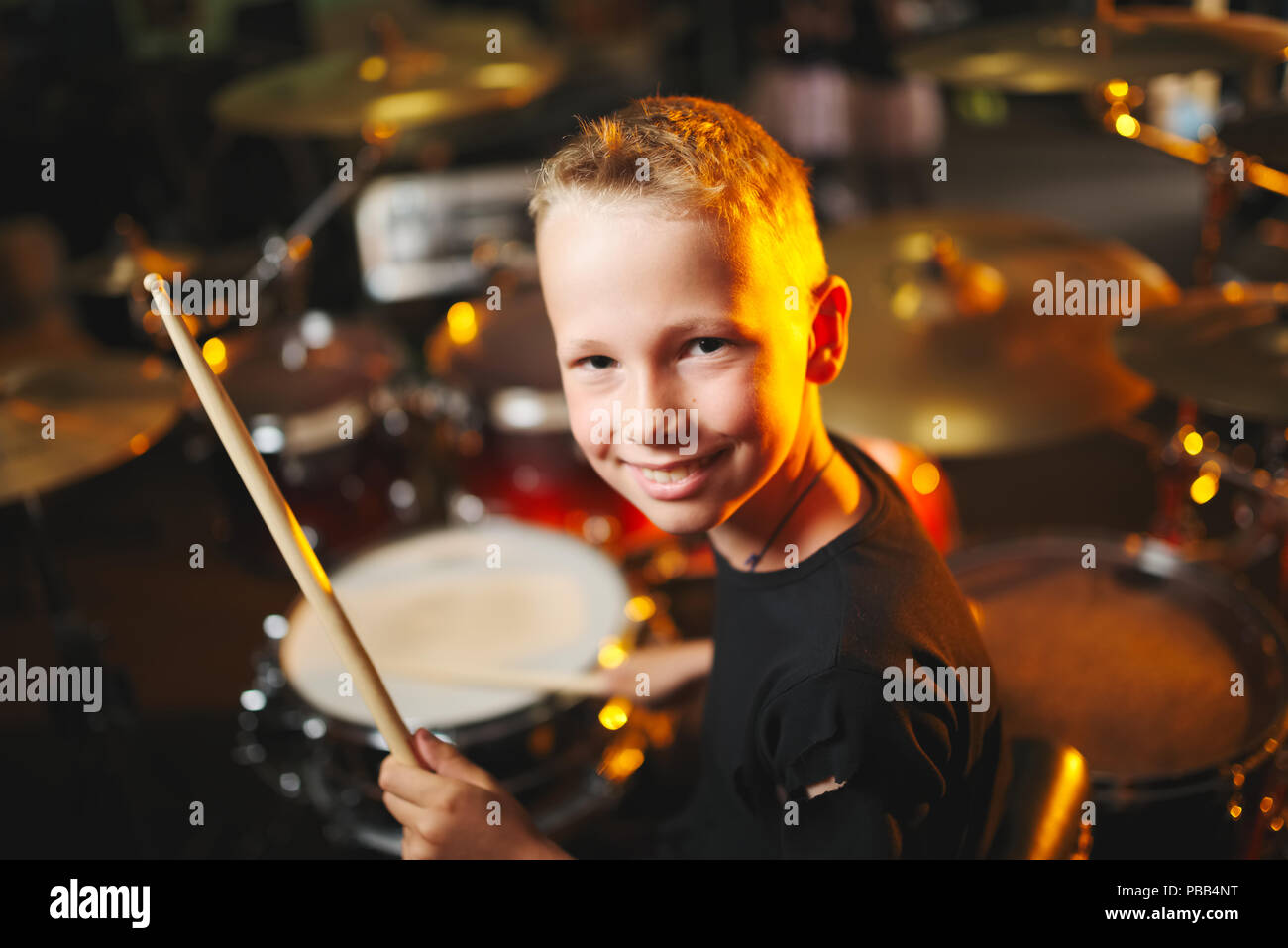 little boy plays drums in recording studio Stock Photo Alamy