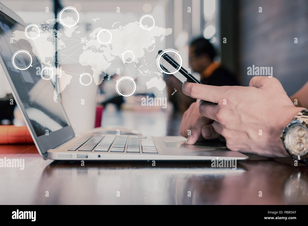 Hand of man use smartphone and laptop with technology of globalization connectivity conceptual Stock Photo