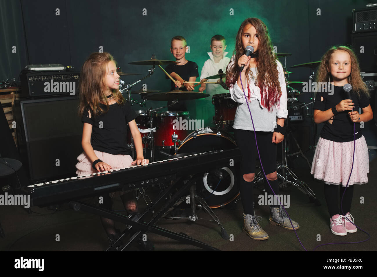 happy children singing and playing music in studio Stock Photo - Alamy