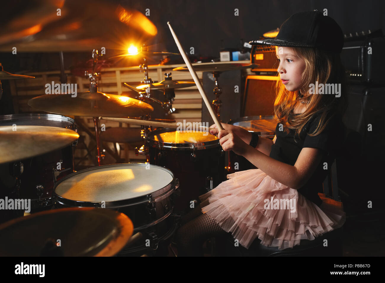 little boy plays drums in recording studio Stock Photo Alamy