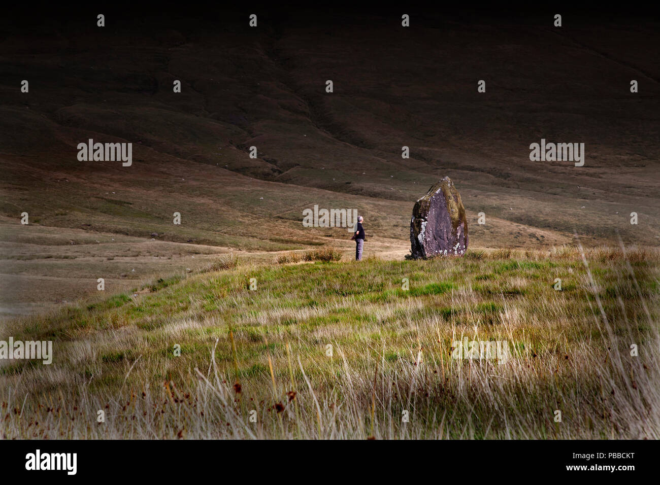 Maen Llia standing stone in the Brecon Beacons National Park, Wales, UK  moody with copy space mid distance Stock Photo