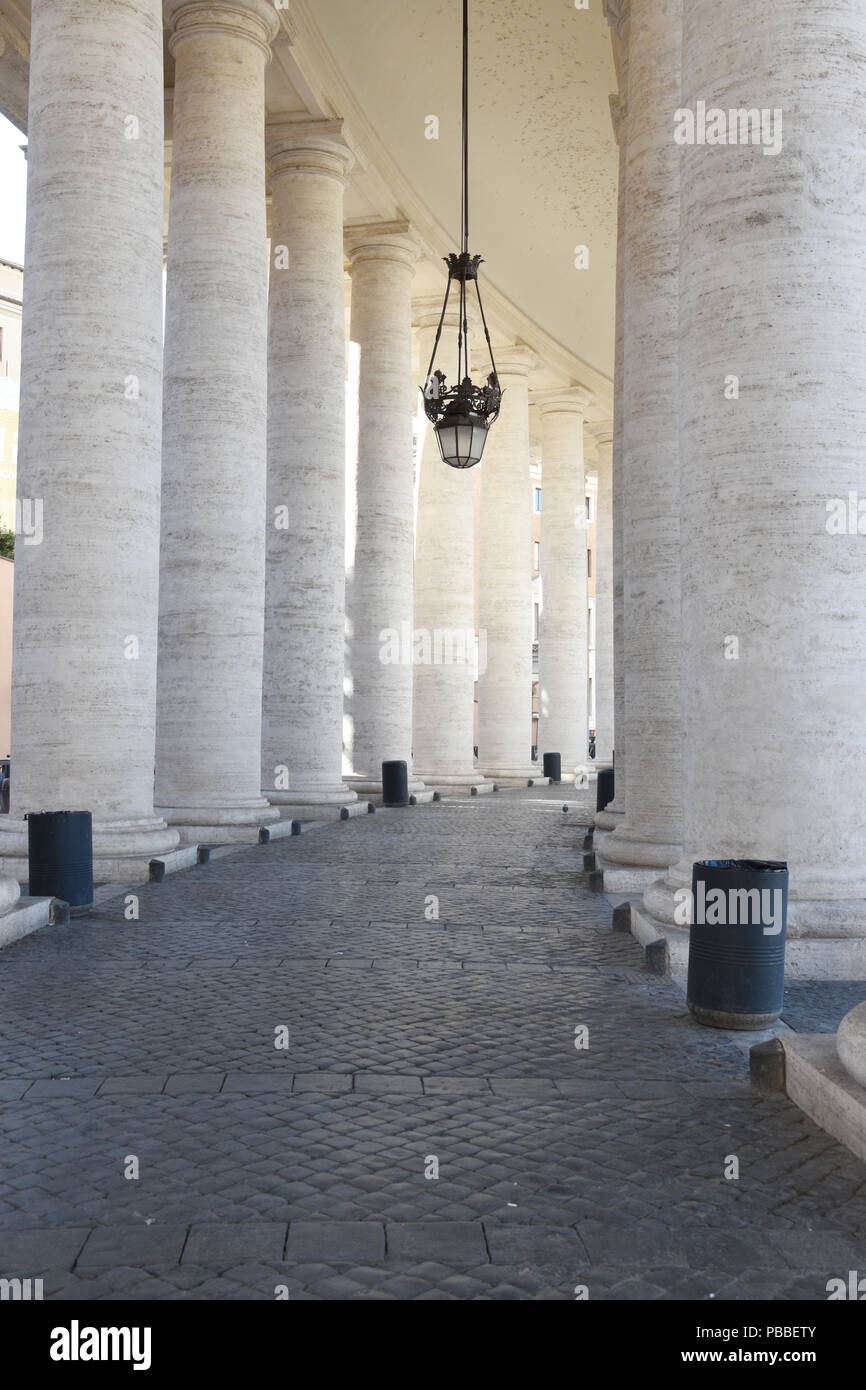 Colonnades in St. Peter's Square, Vatican City, Vatican. The Colonnades consist of 284 Doric columns and 88 pilasters of travertine marble. Bernini bu Stock Photo