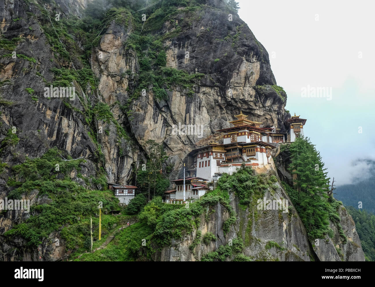 View of Taktsang Palphug Monastery (Tiger Nest) on misty mountain in Paro, Bhutan. Stock Photo