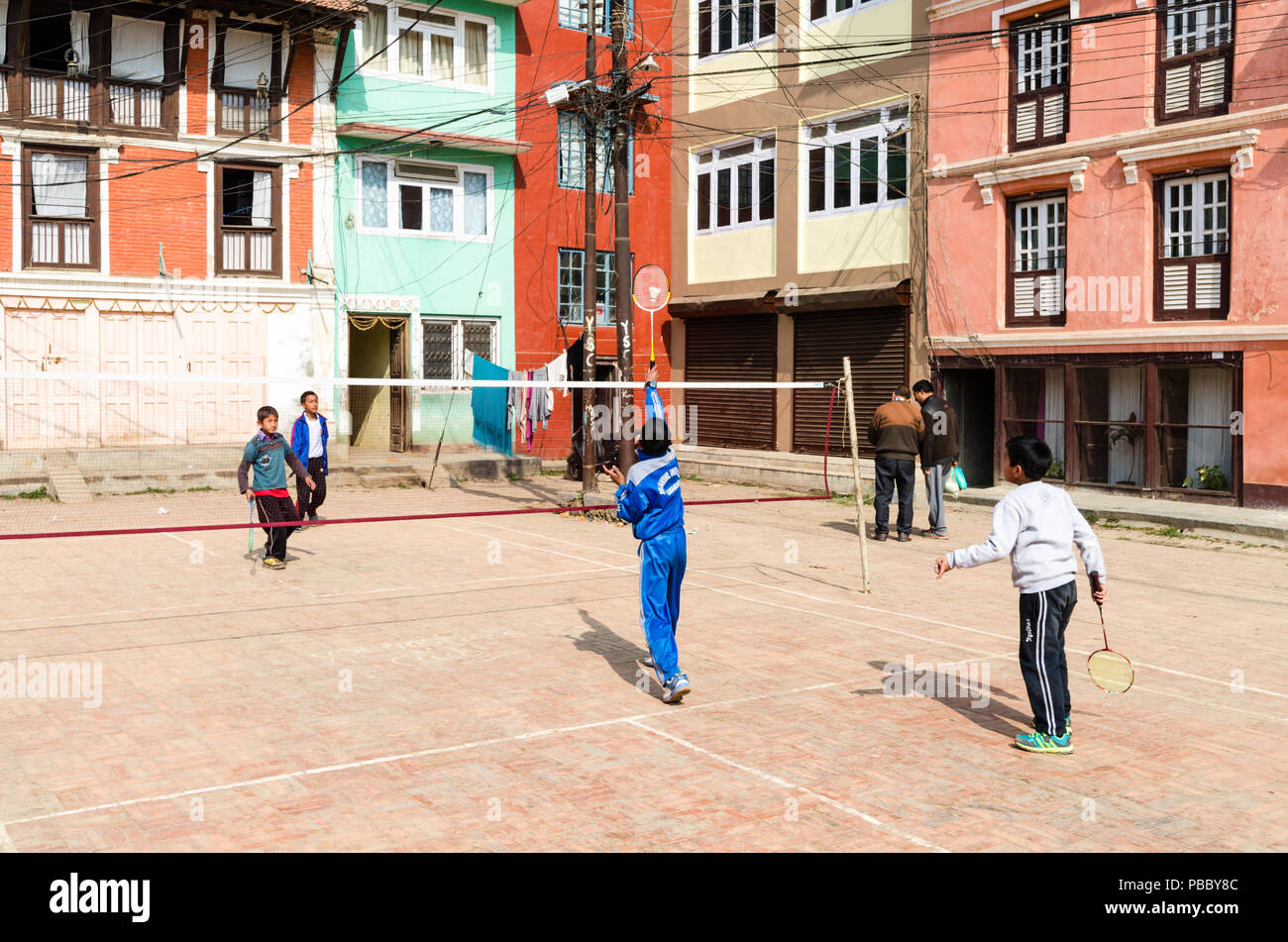 Local children playing badminton in Patan, Nepal Stock Photo