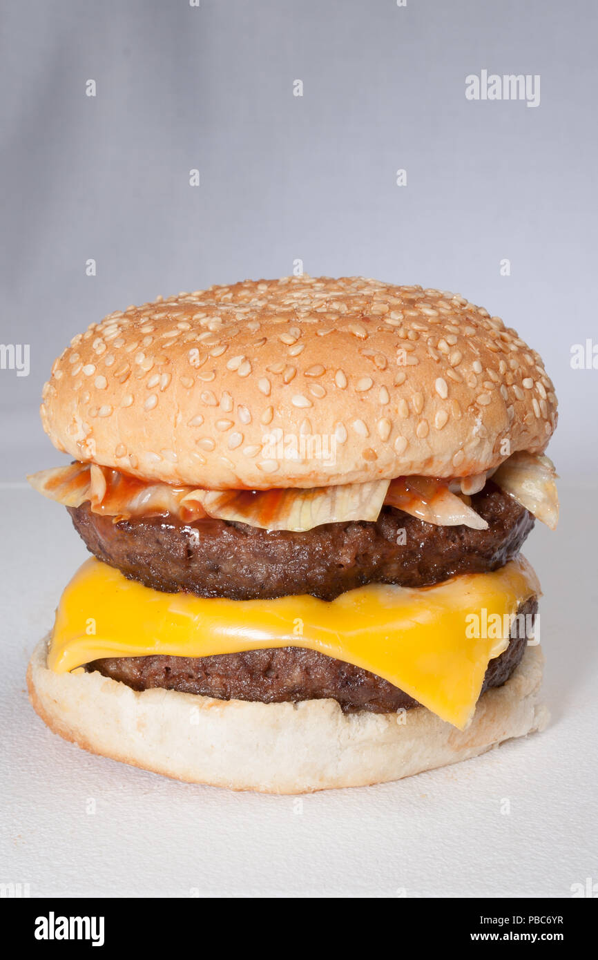 Double beefburger with cheese and relish, upright format Stock Photo ...