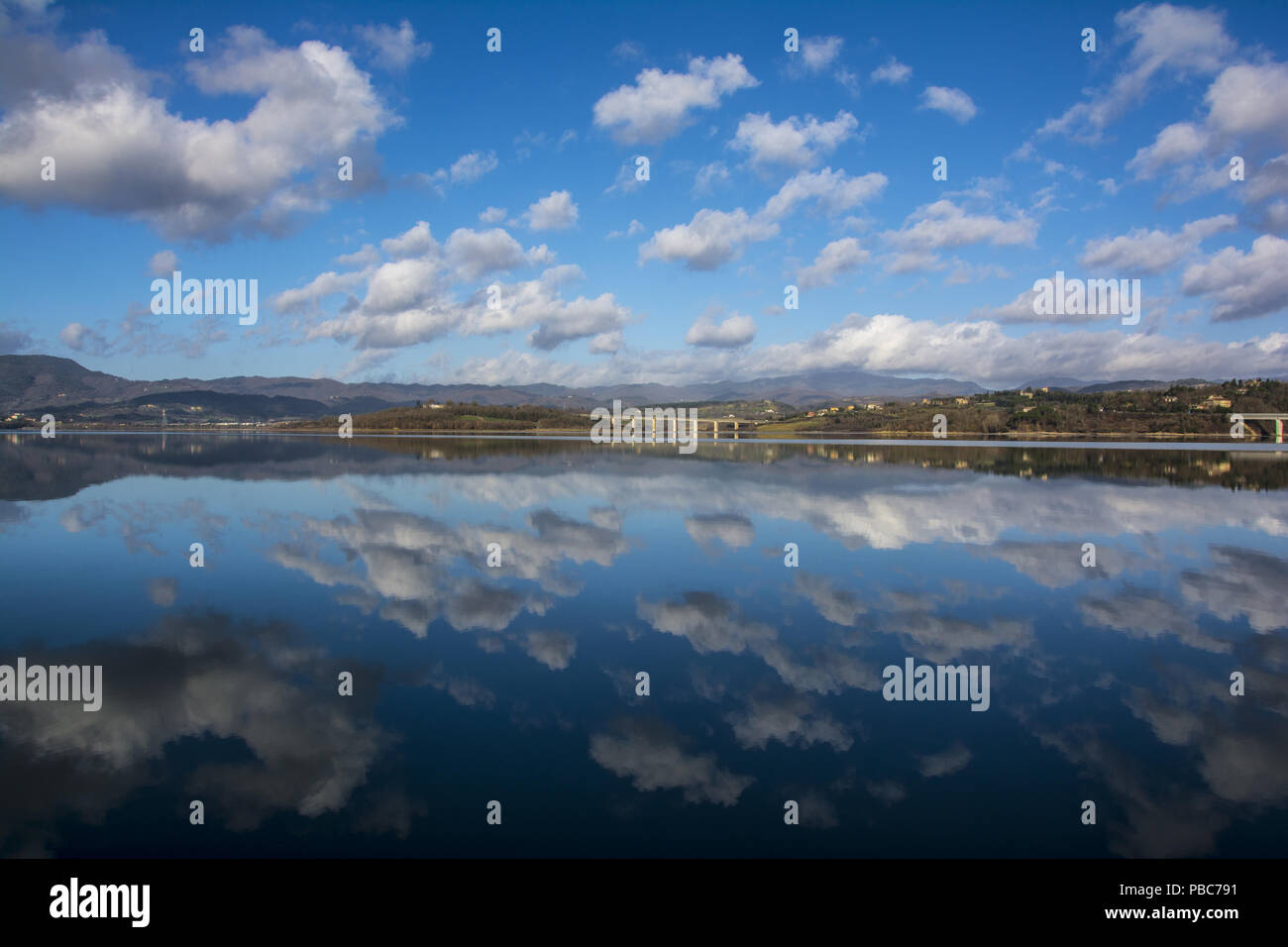 THE BLUE SKY IS MIRROR IN THE LAKE Stock Photo