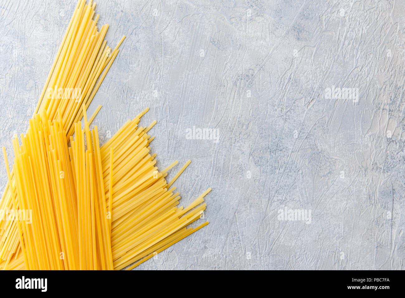 Variety of types and shapes of dry Italian pasta Spaghetti, Linguine