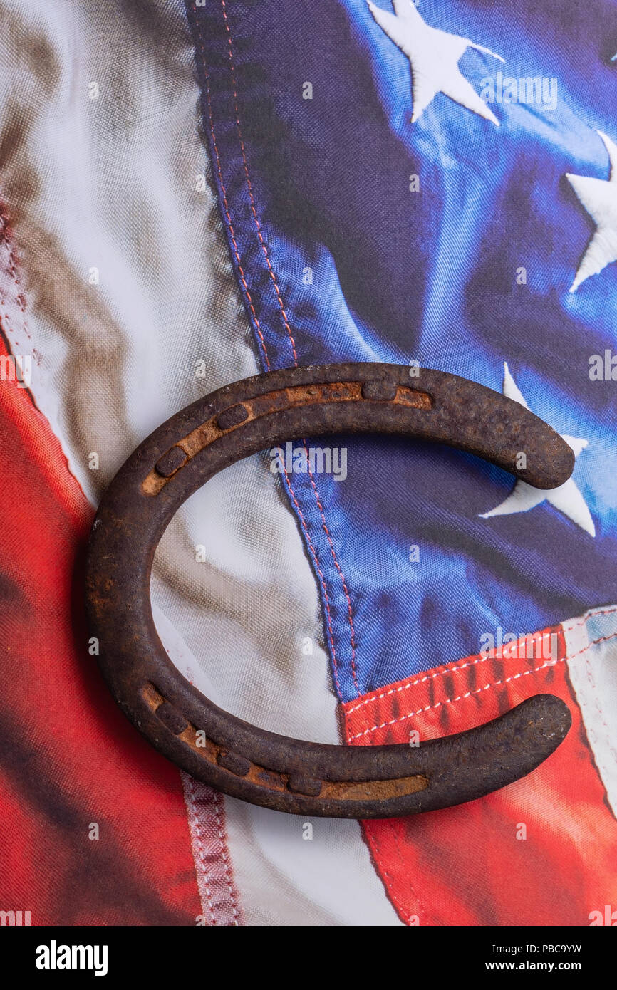 Old rusty horseshoe on USA patriotic background with room for text Stock Photo