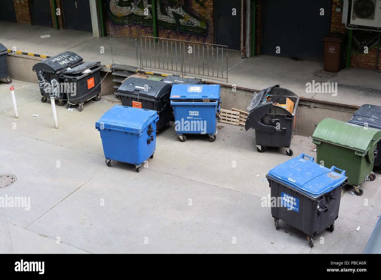 Dumpster on a backyard in Berlin Stock Photo Alamy