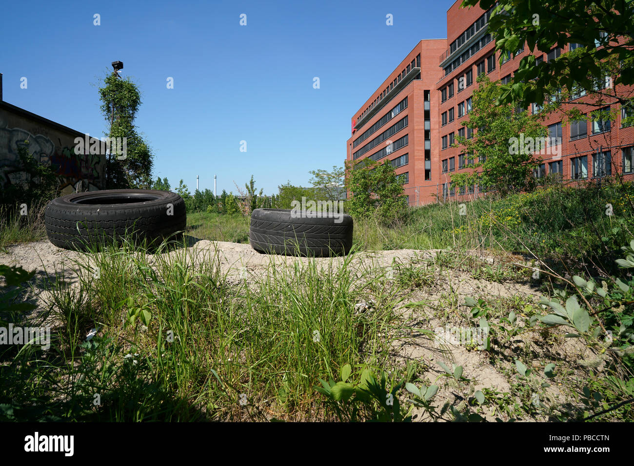 abandoned property with old car tires in Berlin-Kreuzberg Stock Photo