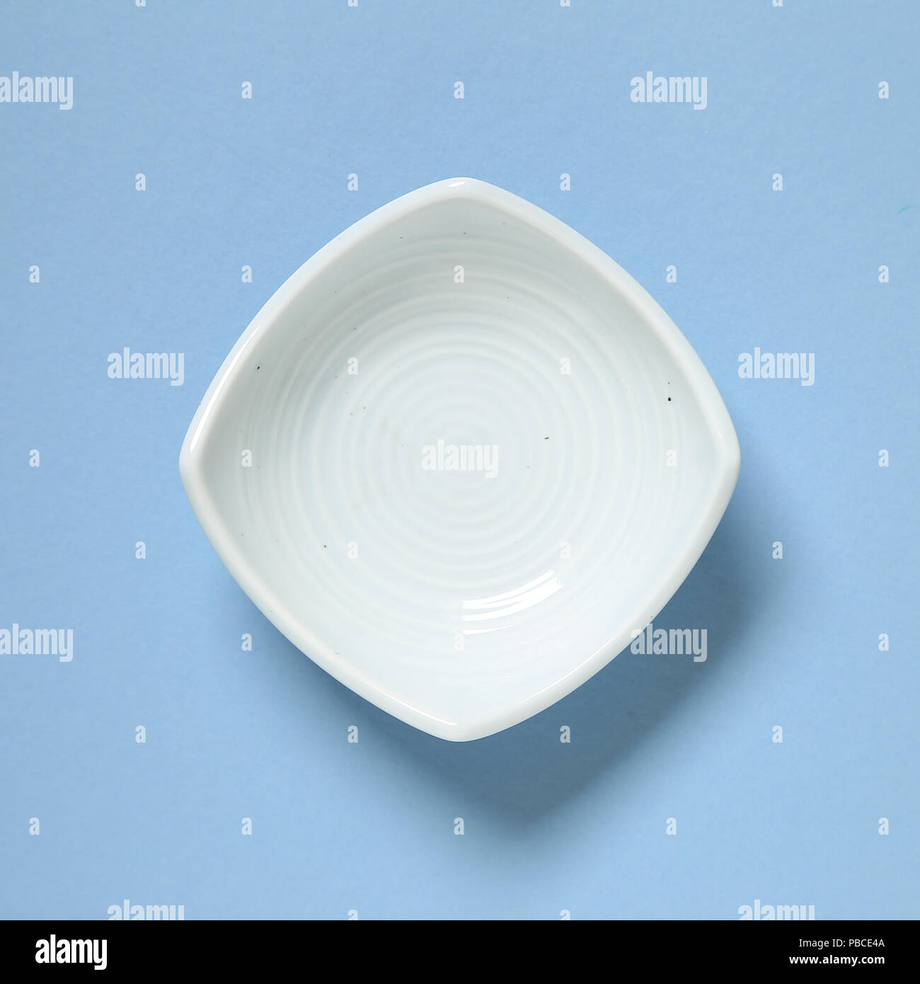 Light blue dish isolated on blue background Stock Photo