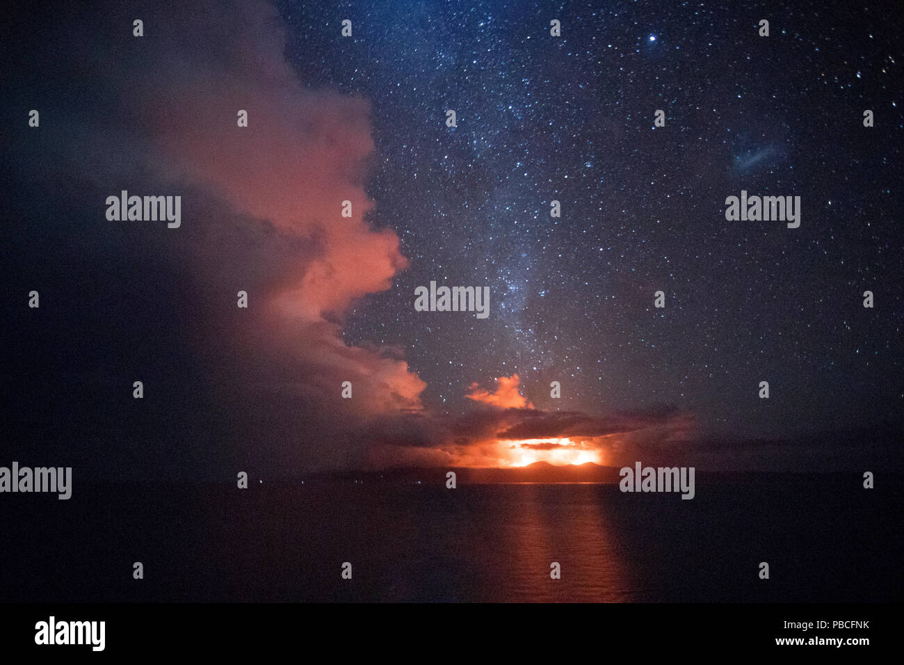 The Ambrym twin volcanoes errupting under the Milky Way - Vanuatu Stock Photo