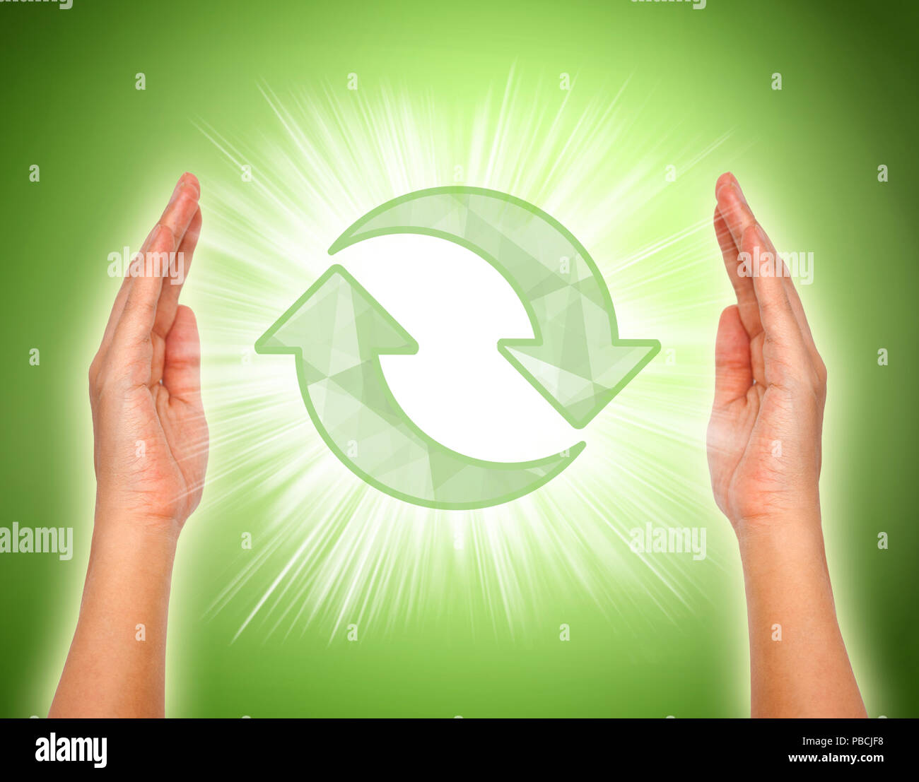 Hands with recycle icon in the middle, Conceptual image Stock Photo - Alamy