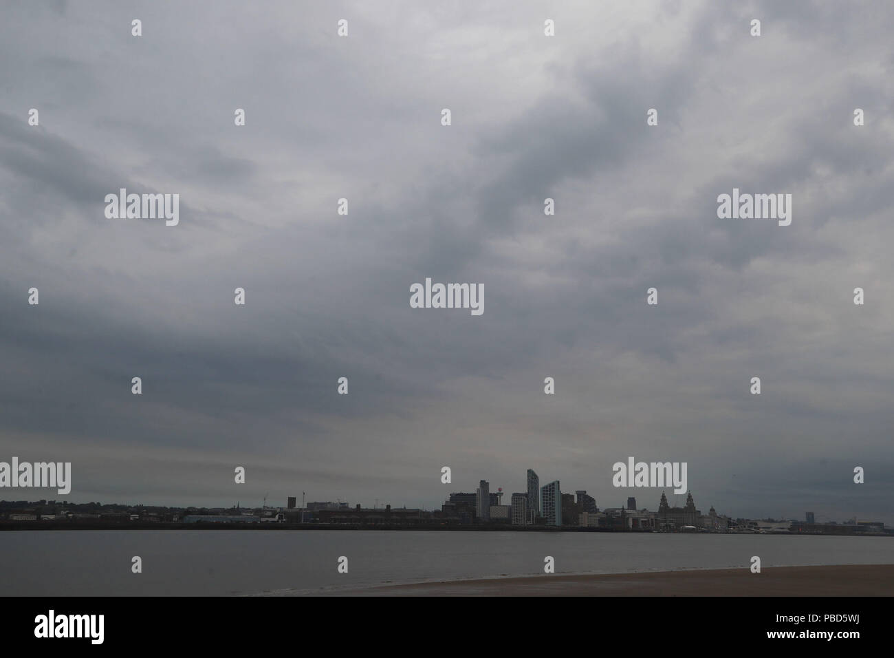 Clouds over Liverpool Waterfront obscuring a view of the 'Blood moon', the longest lunar eclipse of the century which sees Earth's natural satellite turn blood red. Stock Photo
