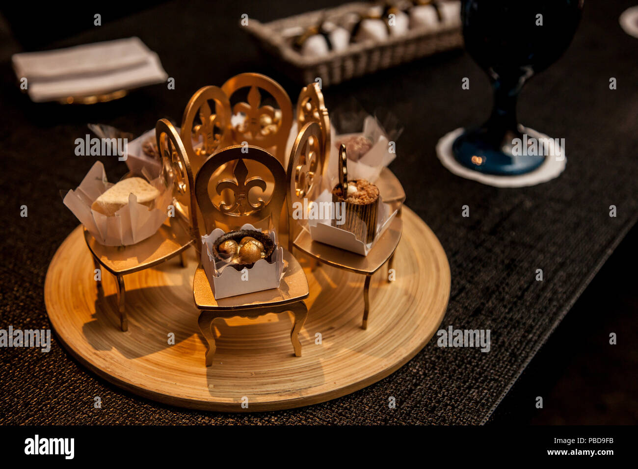 Elegant Party Candy In Small Decorative Golden Chairs Party