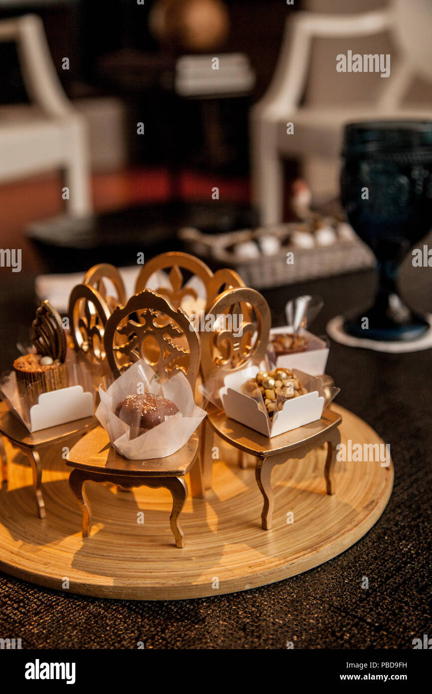 Elegant Party Candy In Small Decorative Golden Chairs Party