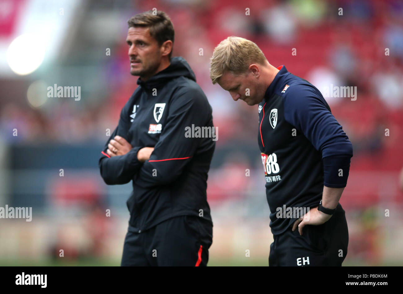 AFC Bournemouth manager Eddie Howe (right) and assistant manager Jason Tindall (left) during a pre-season friendly match at Ashton Gate, Bristol. PRESS ASSOCIATION Photo. Picture date: Friday July 27, 2018. See PA story SOCCER Bristol City. Photo credit should read: Nick Potts/PA Wire. EDITORIAL USE ONLY No use with unauthorised audio, video, data, fixture lists, club/league logos or 'live' services. Online in-match use limited to 75 images, no video emulation. No use in betting, games or single club/league/player publications. Stock Photo