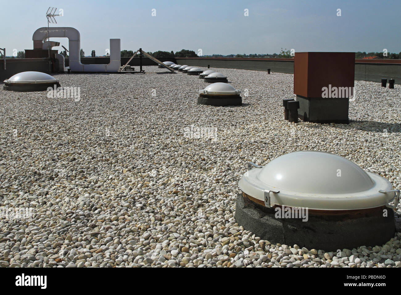 Flat roof with gravel and sky light windoows Stock Photo Alamy