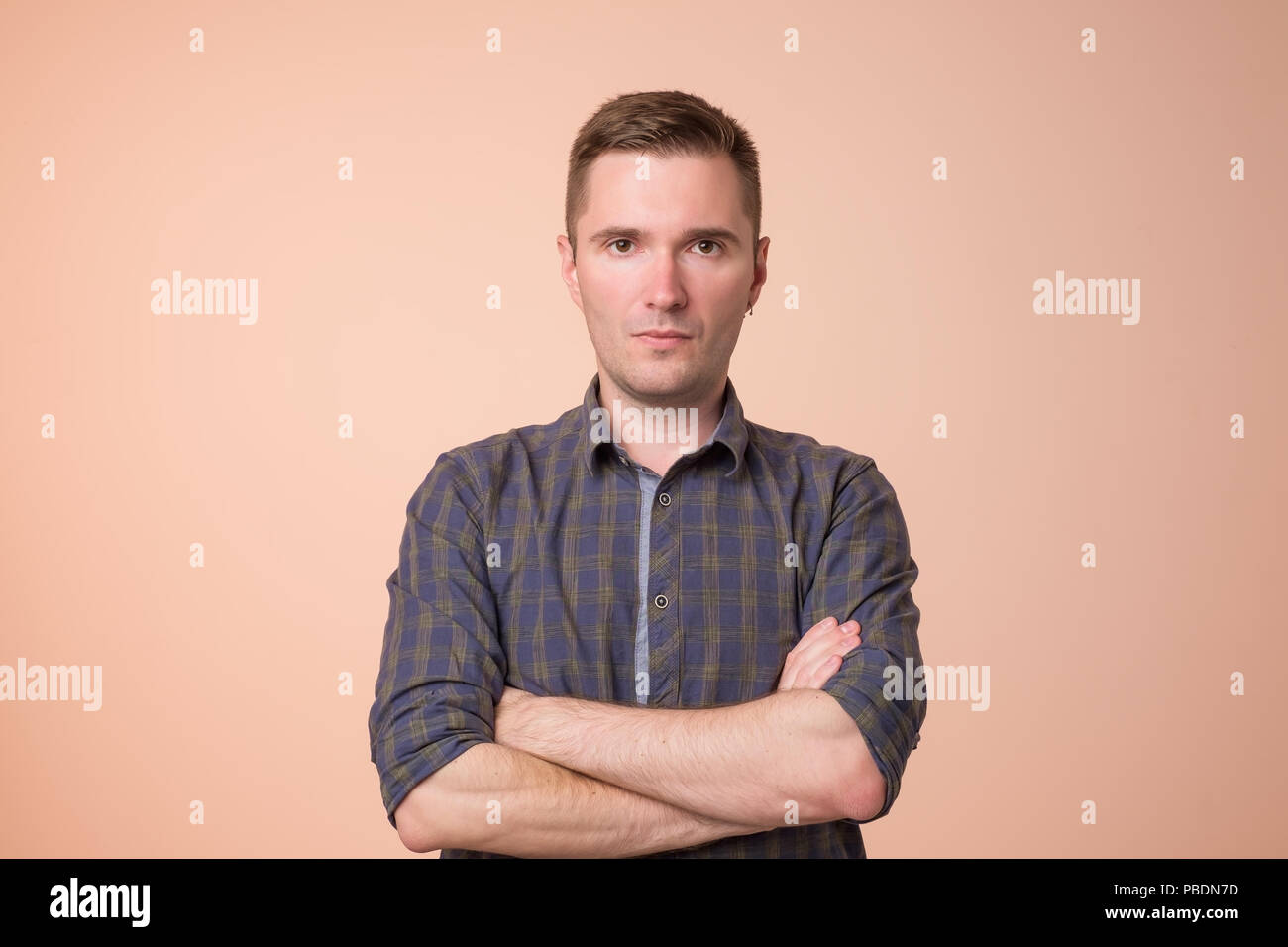 Serious mature middle aged man looking into camera Stock Photo