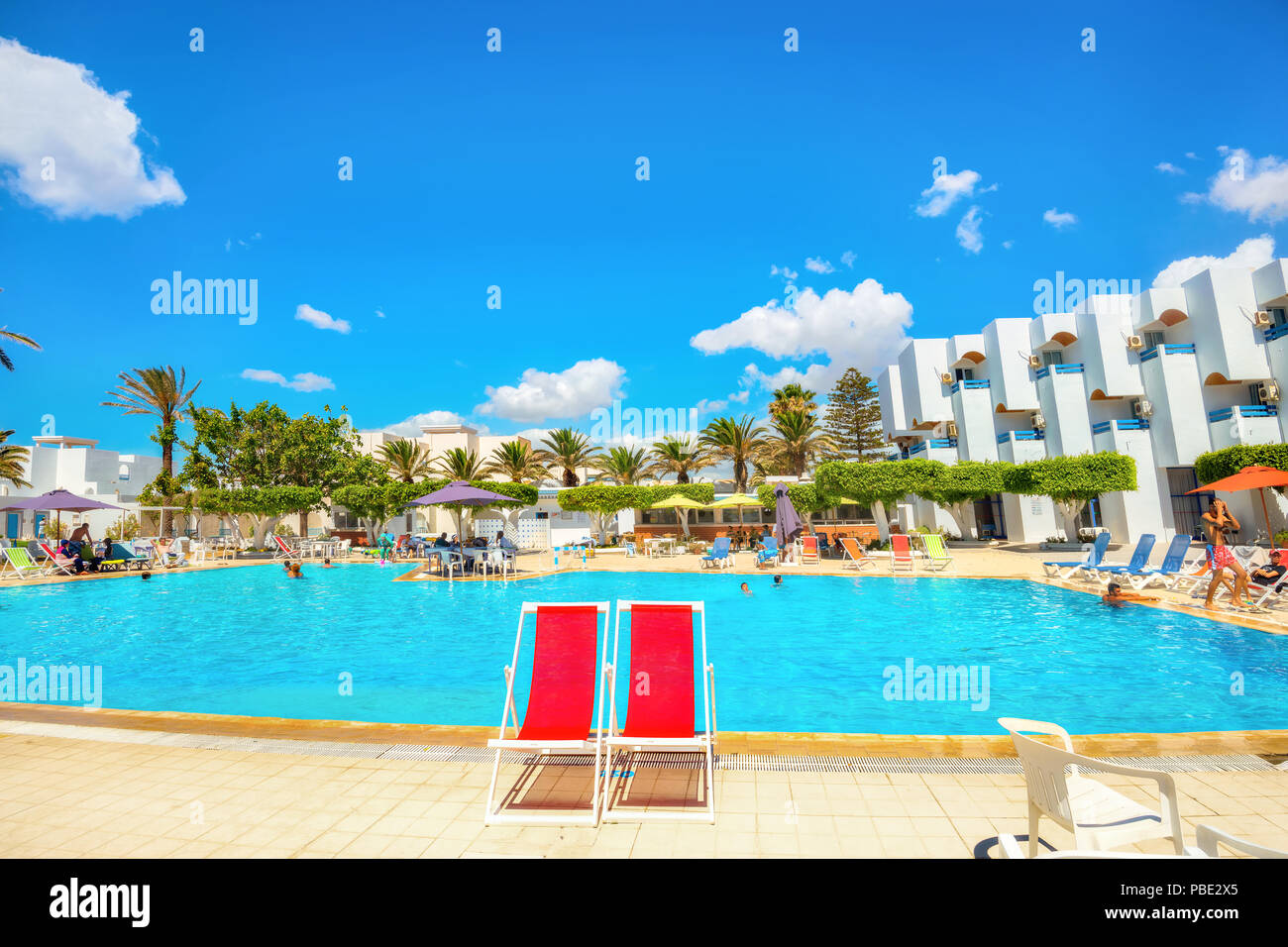 Courtyard with swimming pool of resort hotel on tunisian mediterranean seaside. Nabeul, Tunisia, North Africa Stock Photo