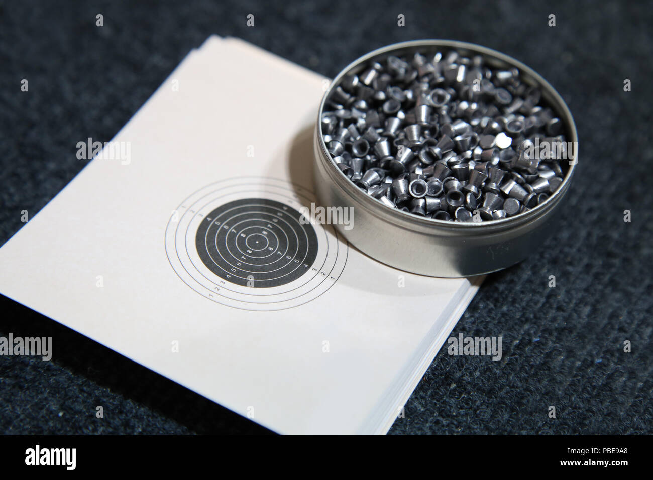 aluminum can of lead pellets for air rifle and target Stock Photo Alamy