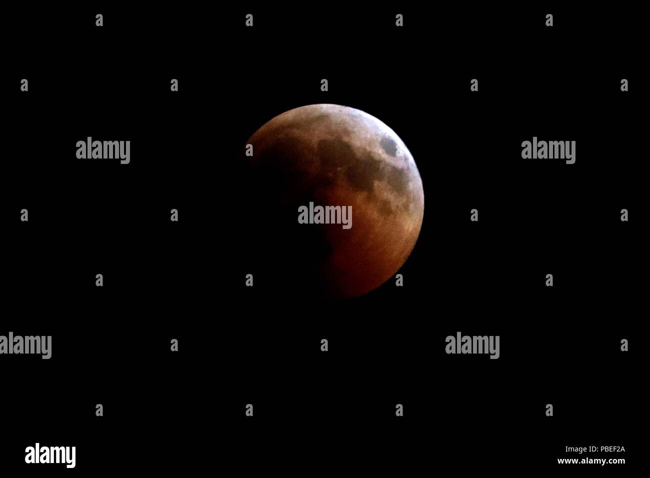 Amman Jordan. 27th July 2018. The moon is seen during a lunar eclipse in Amman Jordan July 27 2018. Credit Mohammad Abu Ghosh Xinhua Alamy Live News Stock Photo Alamy
