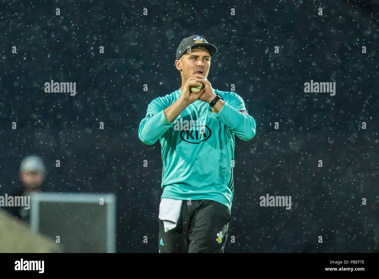 London, UK. 27 July, 2018. Jason Roy takes a great catch on the boundary to get rid of  Roelof van der Merwe off the bowling of Mathew Pillans in the rain  fielding for Surrey against  Somerset in the Vitality T20 Blast match at the Kia Oval. David Rowe/Alamy Live News Stock Photo
