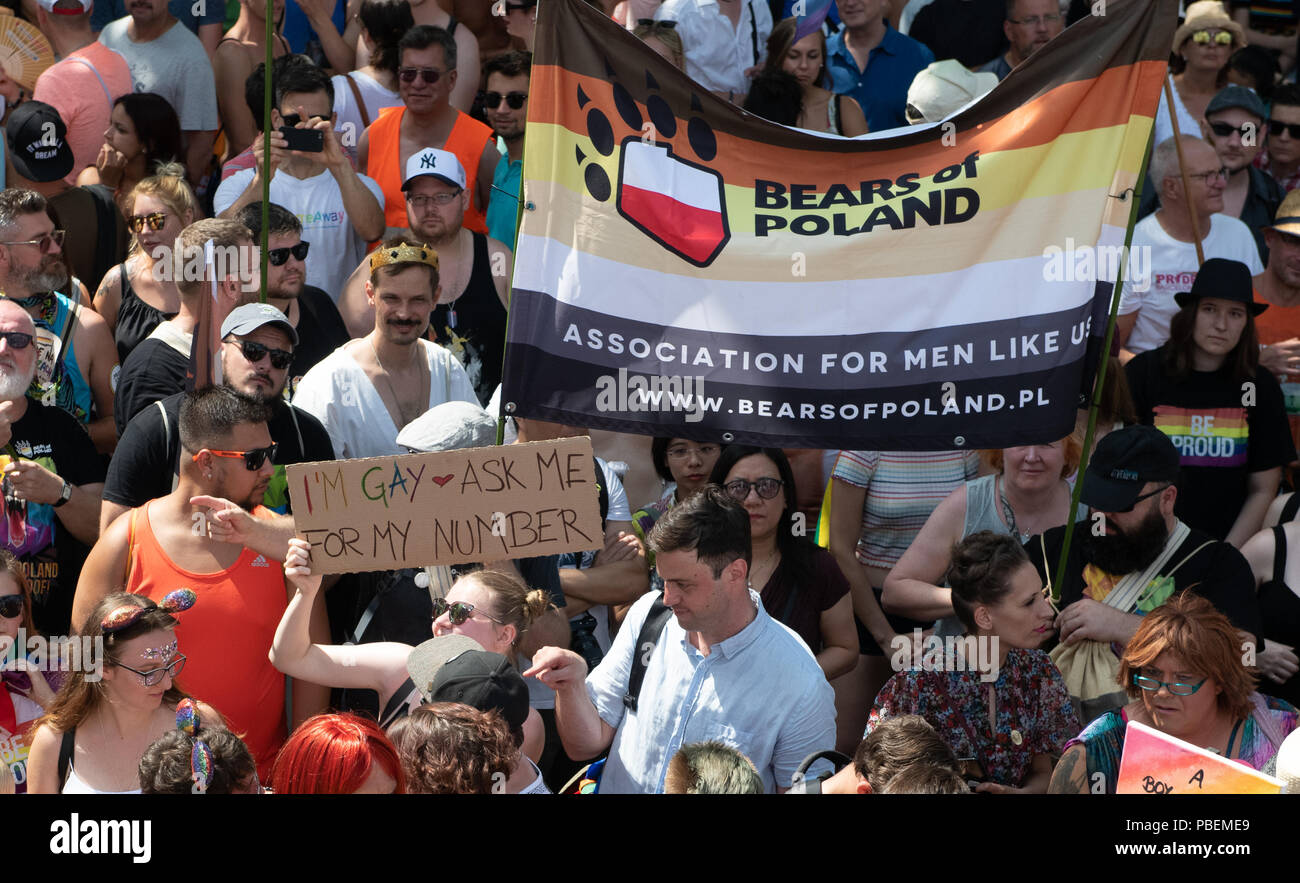Berlin, Germany. 28th July, 2018. Participants of the parade for Christopher Street Day (CSD) fly the flag of the Polish 'Bear Community', gay or bisexual men with hairy bodies, through the city centre. The traditional parade of homosexuals takes place for the 40th time in Berlin. There are CSD parades and street festivals in around 40 cities throughout Germany. Credit: Paul Zinken/dpa/Alamy Live News Stock Photo