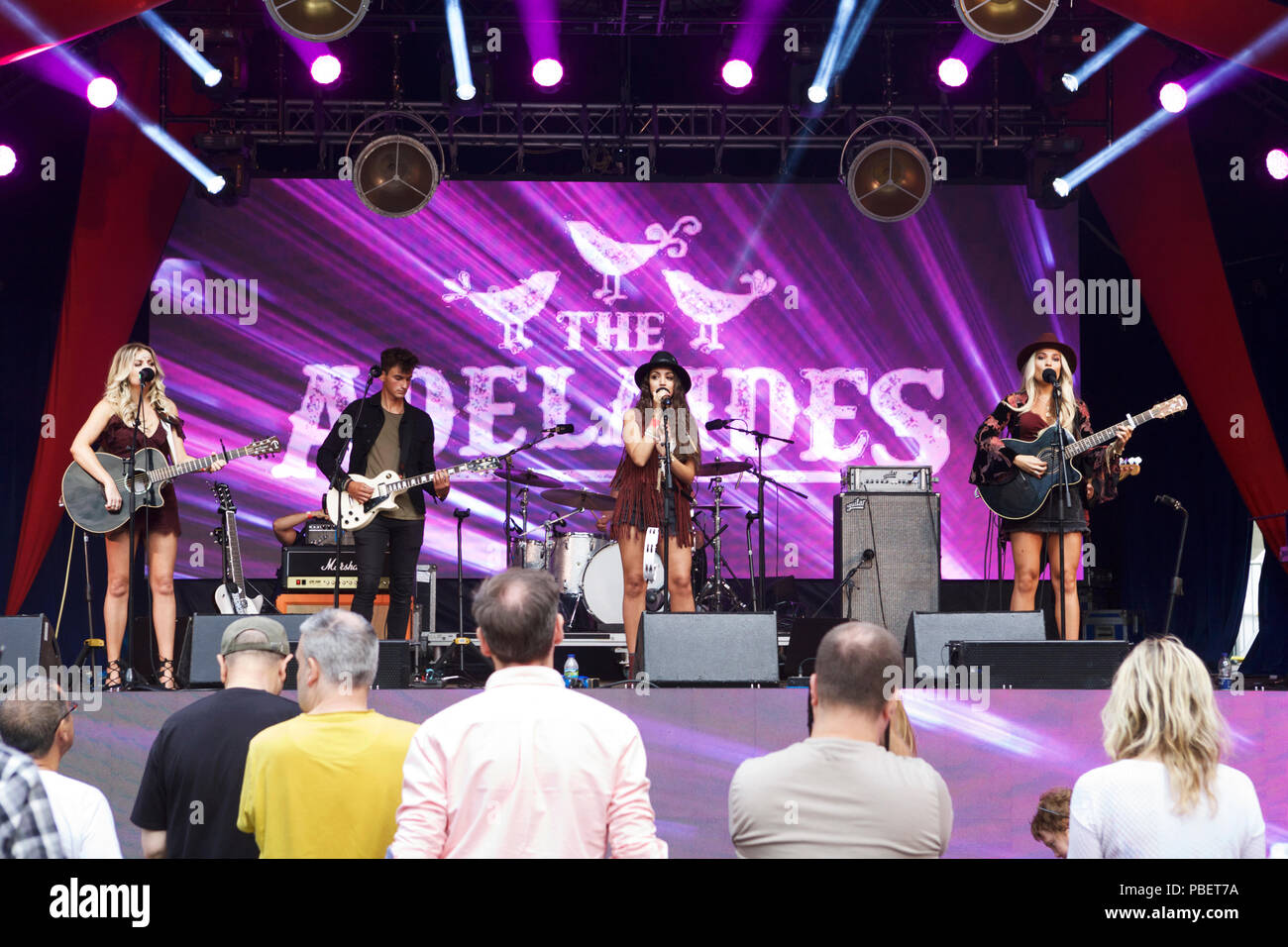 London UK, 28th July, 2018. A Country music festival - Nashville Meets London - on the 28th and 29th July at Canary Wharf. The Adelaides perform on stage. Stock Photo