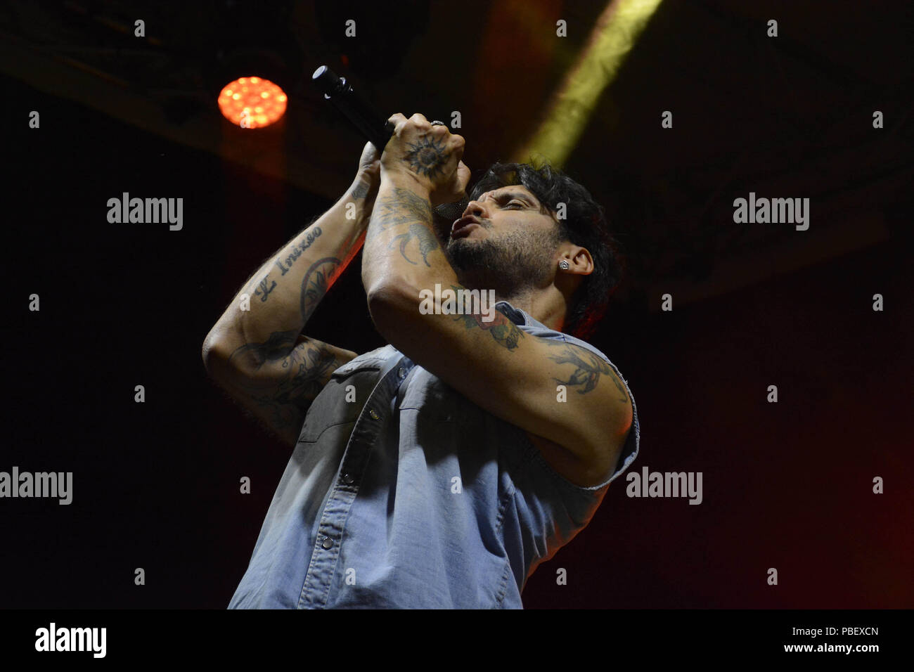 Naples, Italy. 28th July, 2018. The italian singer-songwriter Fabrizio Moro, last winner of Sanremo Festival 2018,  performing live on stage at Arenile di Bagnoli in Naples, Italy for his concert  'Tour 2018'. Credit: Mariano Montella/Alamy Live News Stock Photo