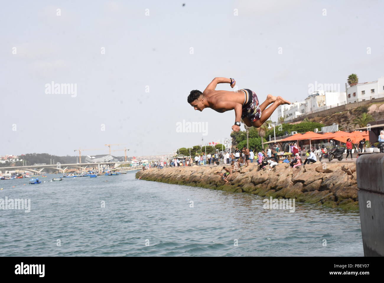 Rabat, Morocco. 28th July, 2018. A boy jumps into water in Rabat, Morocco, on July 28, 2018. Credit: Aissa/Xinhua/Alamy Live News Stock Photo