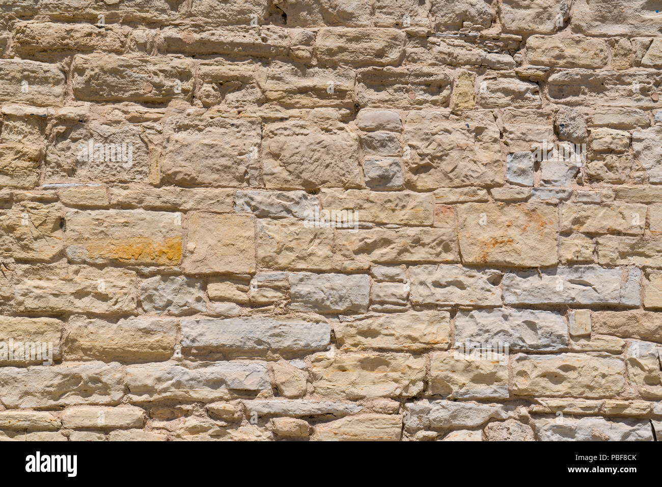 Old masonry historic stone wall background Stock Photo