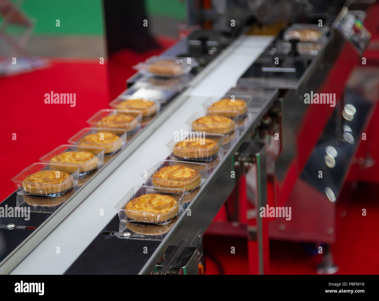 Bread/toast/bun plastic wrapping machine on bakery production line Stock Photo Alamy
