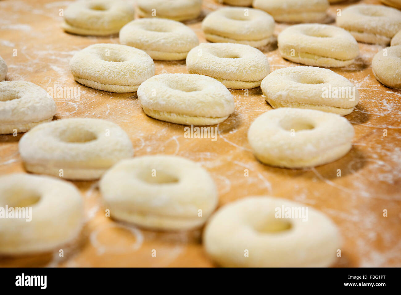 Fresh doughnuts made by hand Stock Photo Alamy