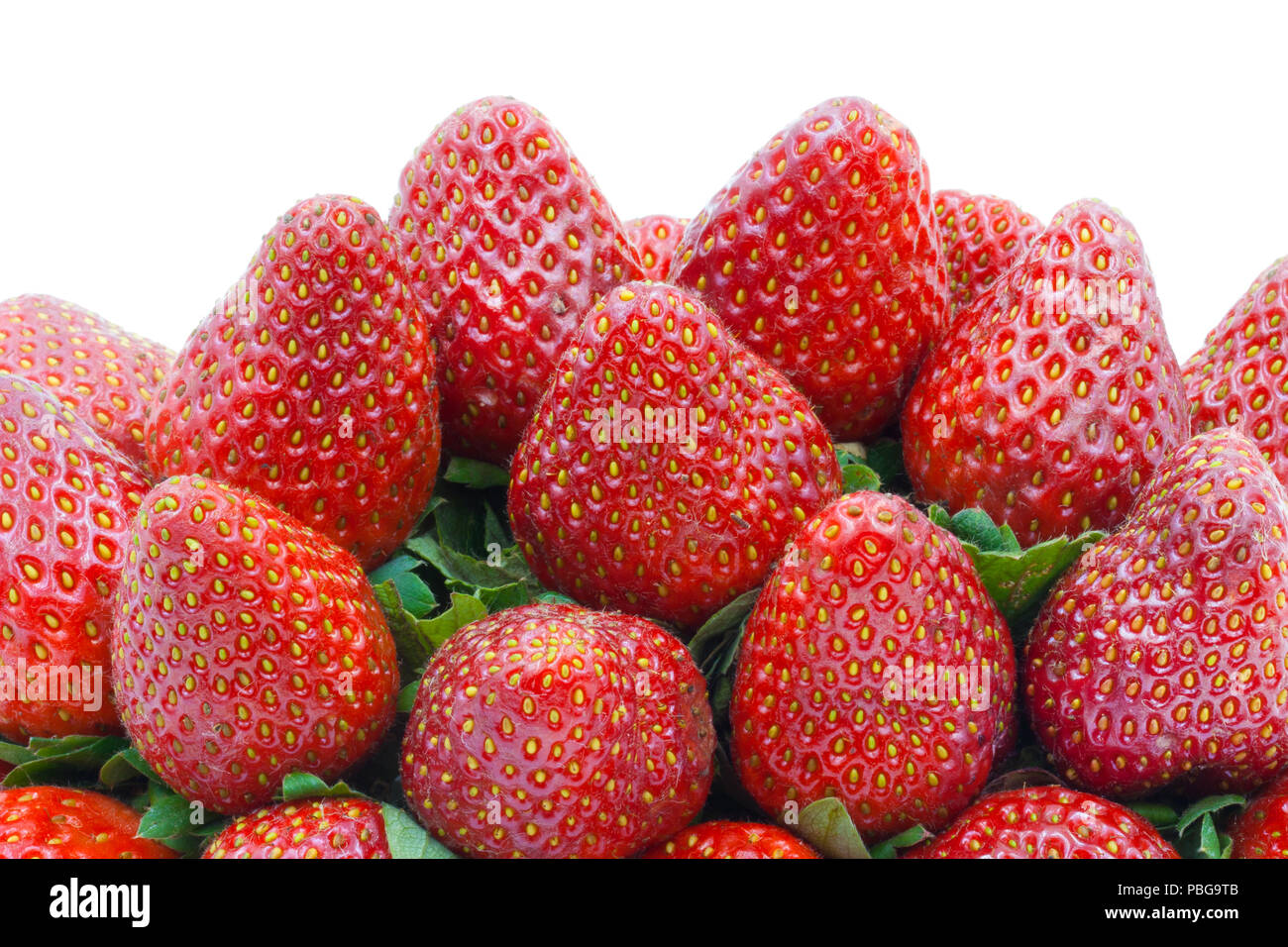Pile strawberries isolated on a white background Stock Photo - Alamy